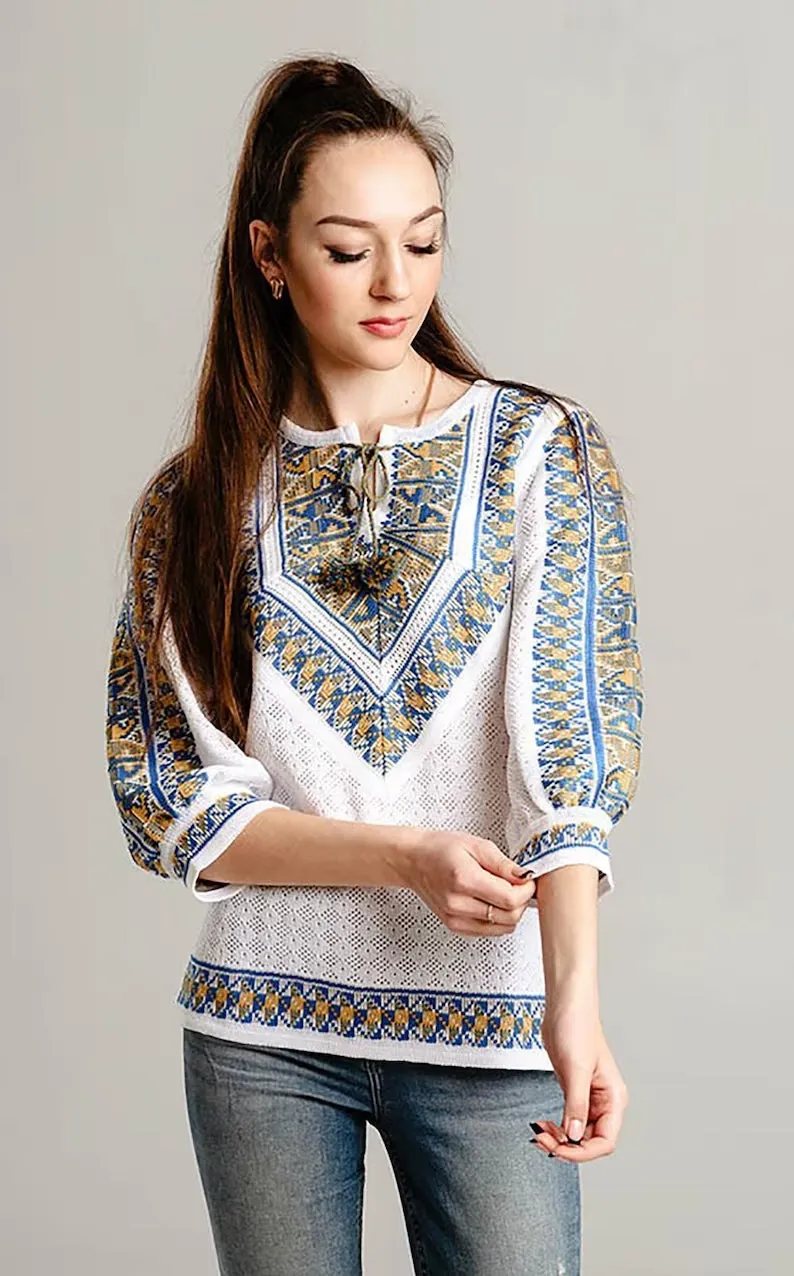Knitted women's vyshyvanka with a yellow-blue ornament