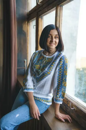 Knitted women's vyshyvanka with a yellow-blue ornament