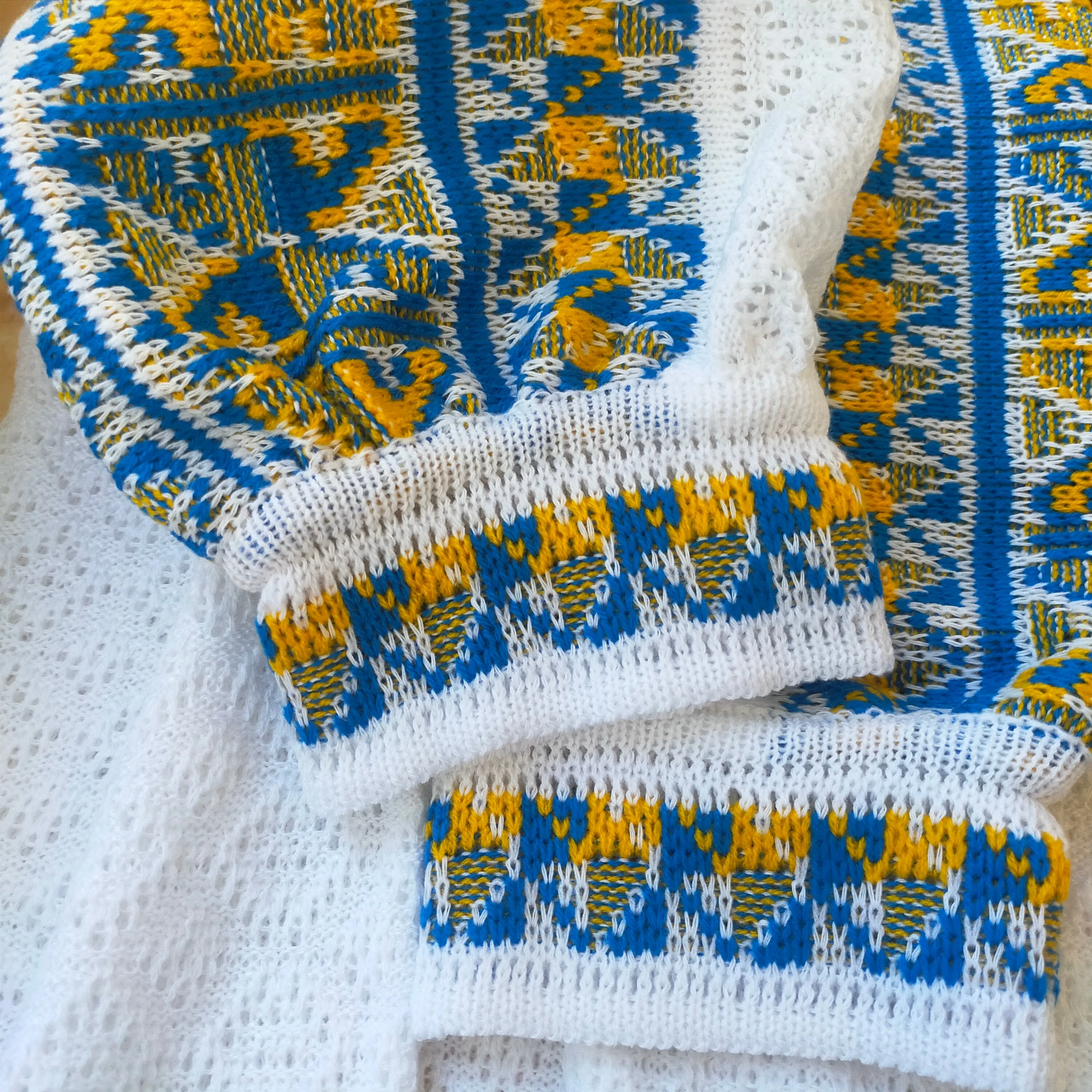 Knitted women's vyshyvanka with a yellow-blue ornament